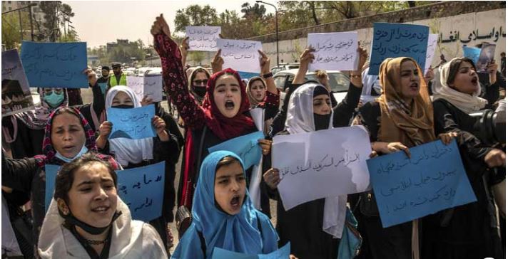 Afghan women weep as Taliban fighters enforce university ban