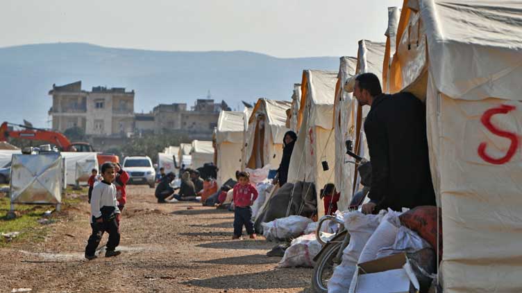 Syria quake survivors battle cold in tents & vehicles