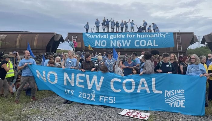 50 climate activists charged after 'halt', shovelling of coal train in Australia